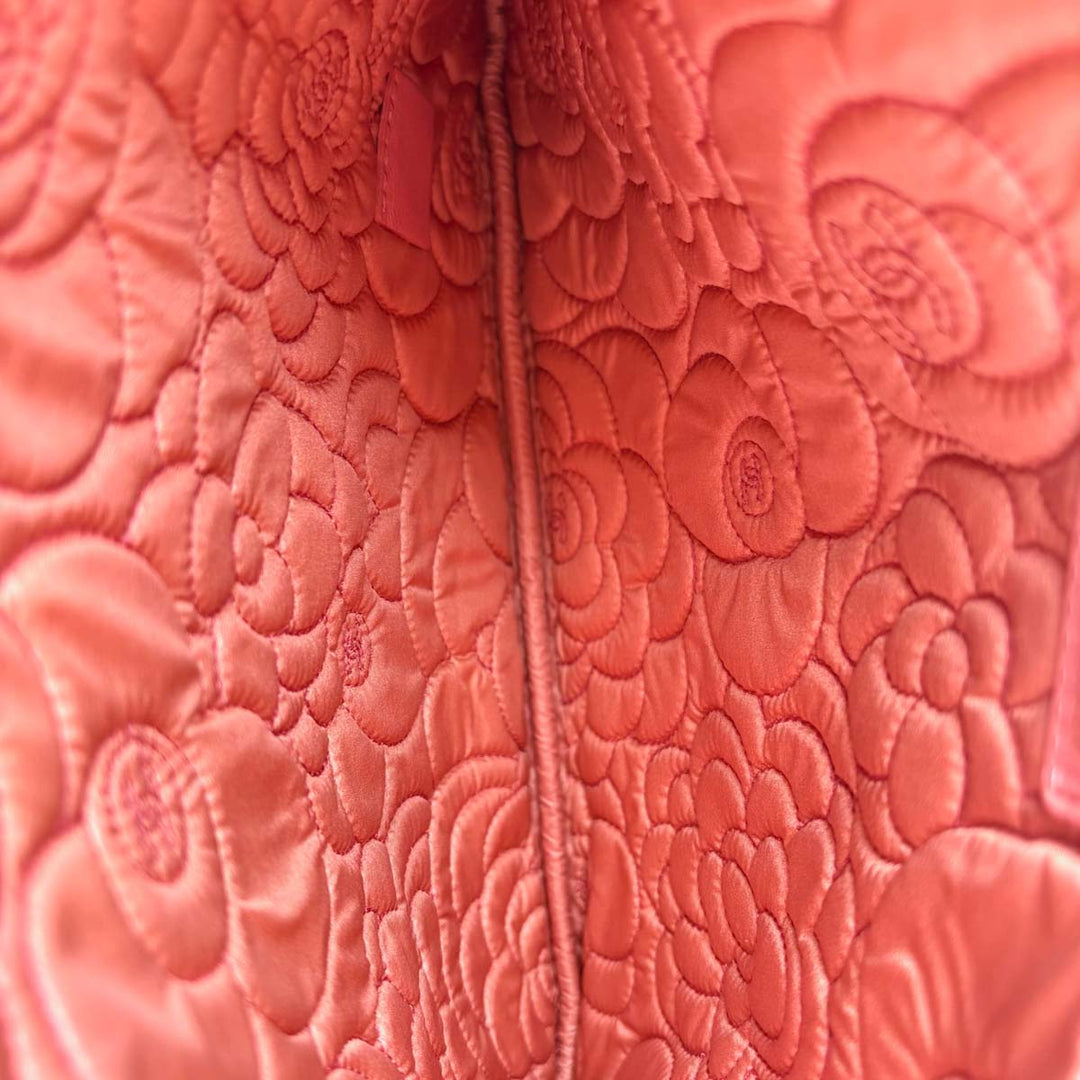 Chanel Embossed Camellia Pouch Bag Pink